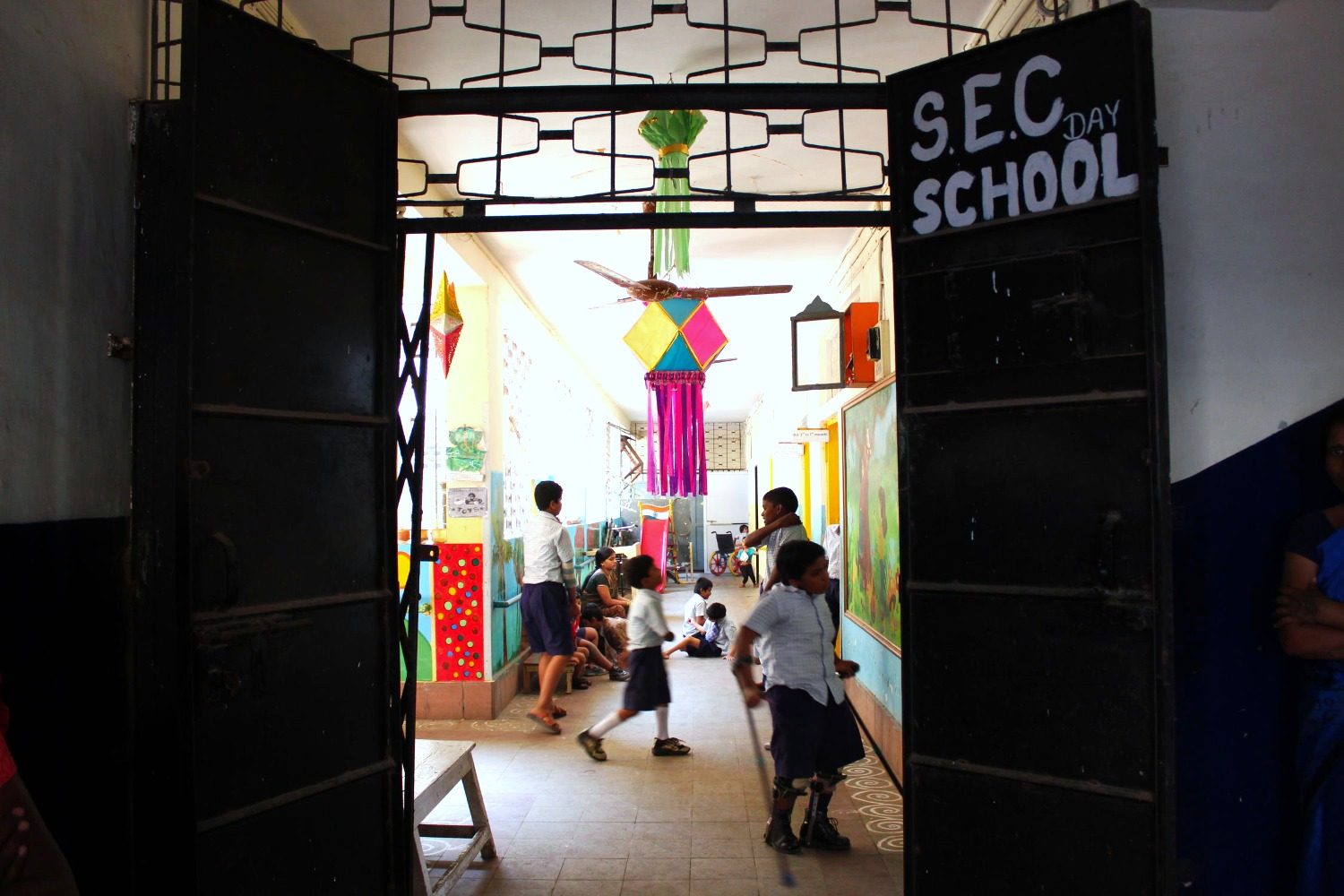 The entrance to an SEC school campus, decorated with festive garlands