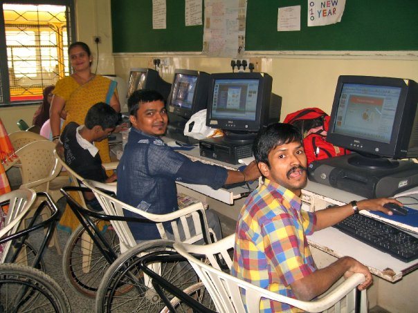 Students working at desktop computers during a computer training session
